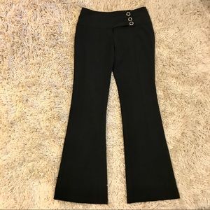 Black slacks with fashionable buttons
